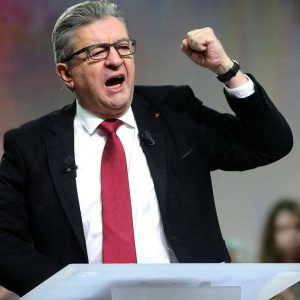 French far-left La France Insoumise (LFI) parliamentary group's president Jean-Luc Melenchon gestures as he delivers a speech in front of an audience during a convention in Reims, northern France on October 17, 2021.  (Photo by FRANCOIS NASCIMBENI / AFP)